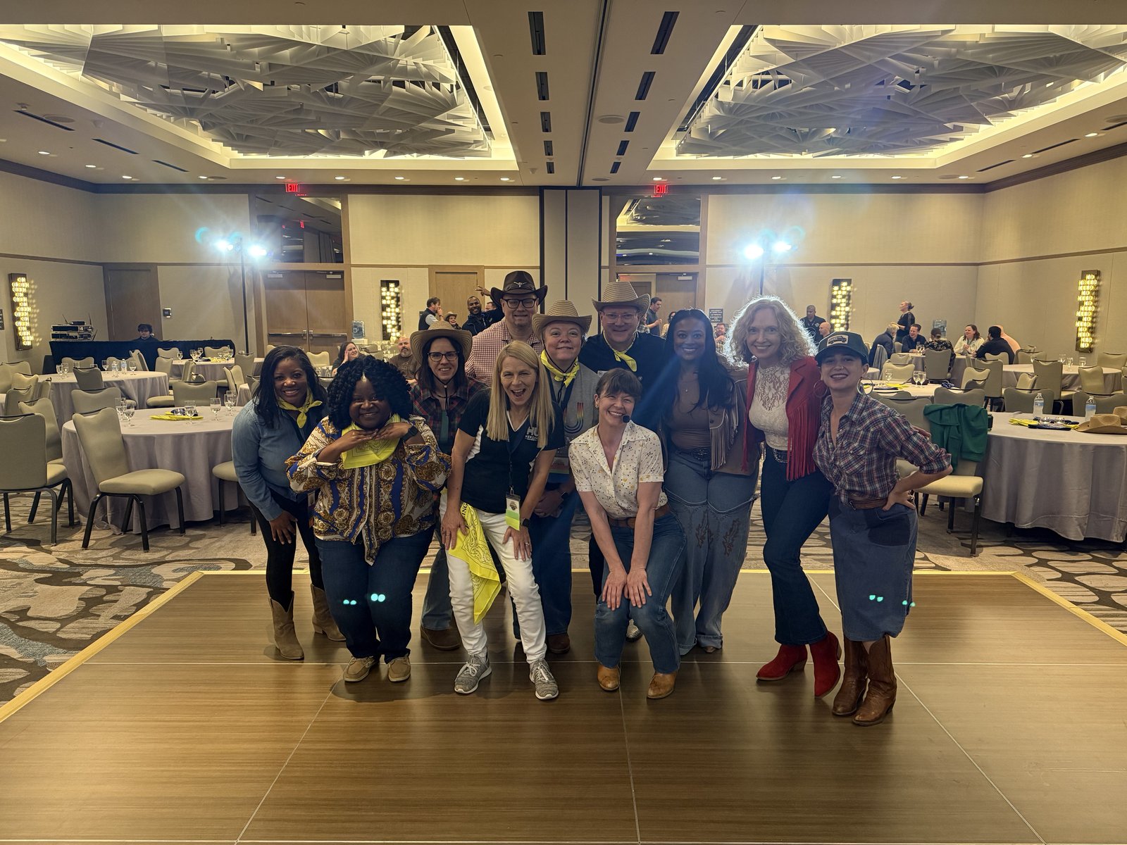 Corporate team building line dance event in hotel ballroom with cowboy hats Austin
