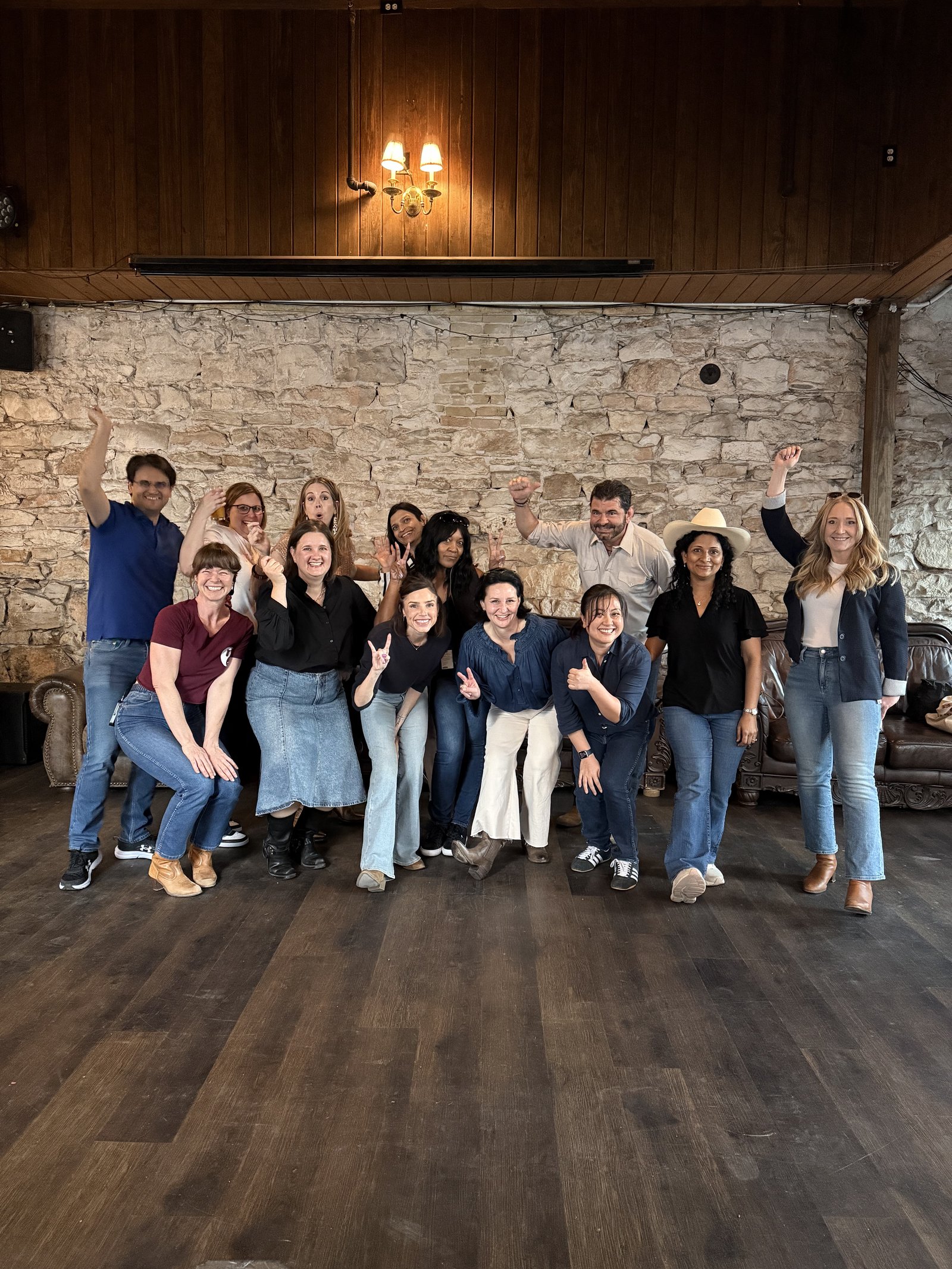 Corporate group team building event at Austin dance venue with stone walls